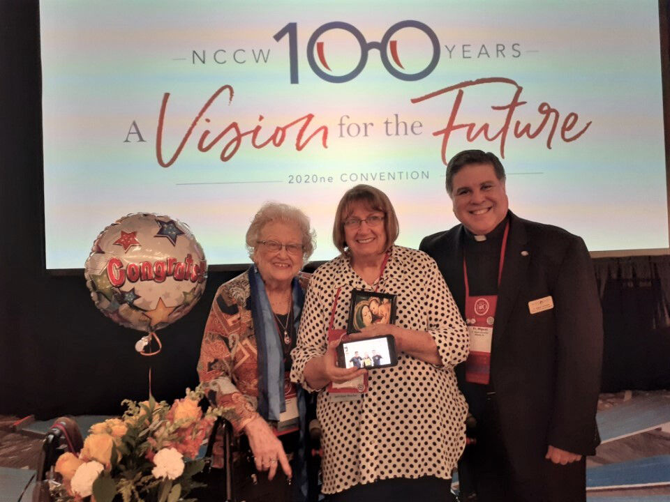 ODCCW member Julie Drake (left) and NCCW chaplain Father Miguel González stand with Kathy Bonner, recipient of the NCCW Our Lady of Good Counsel award.